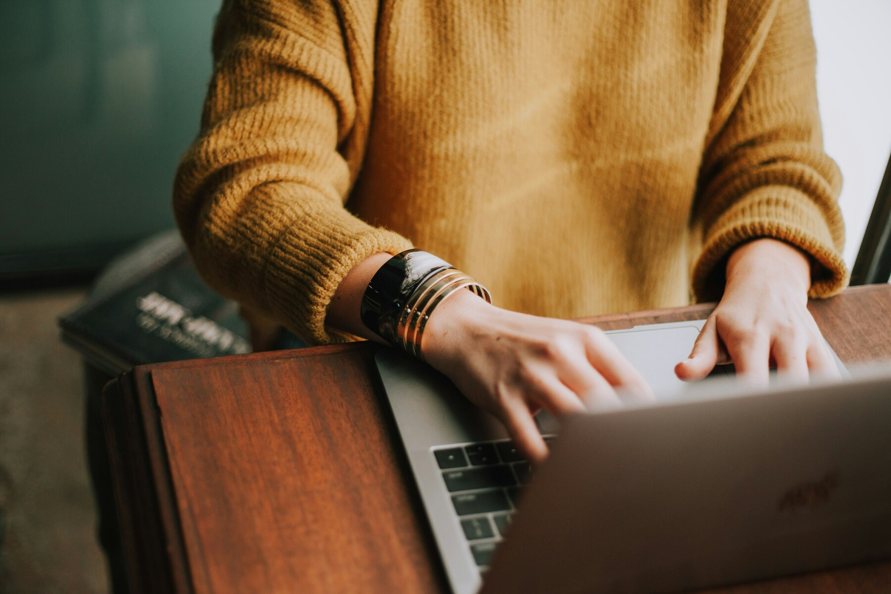 Person typing at computer